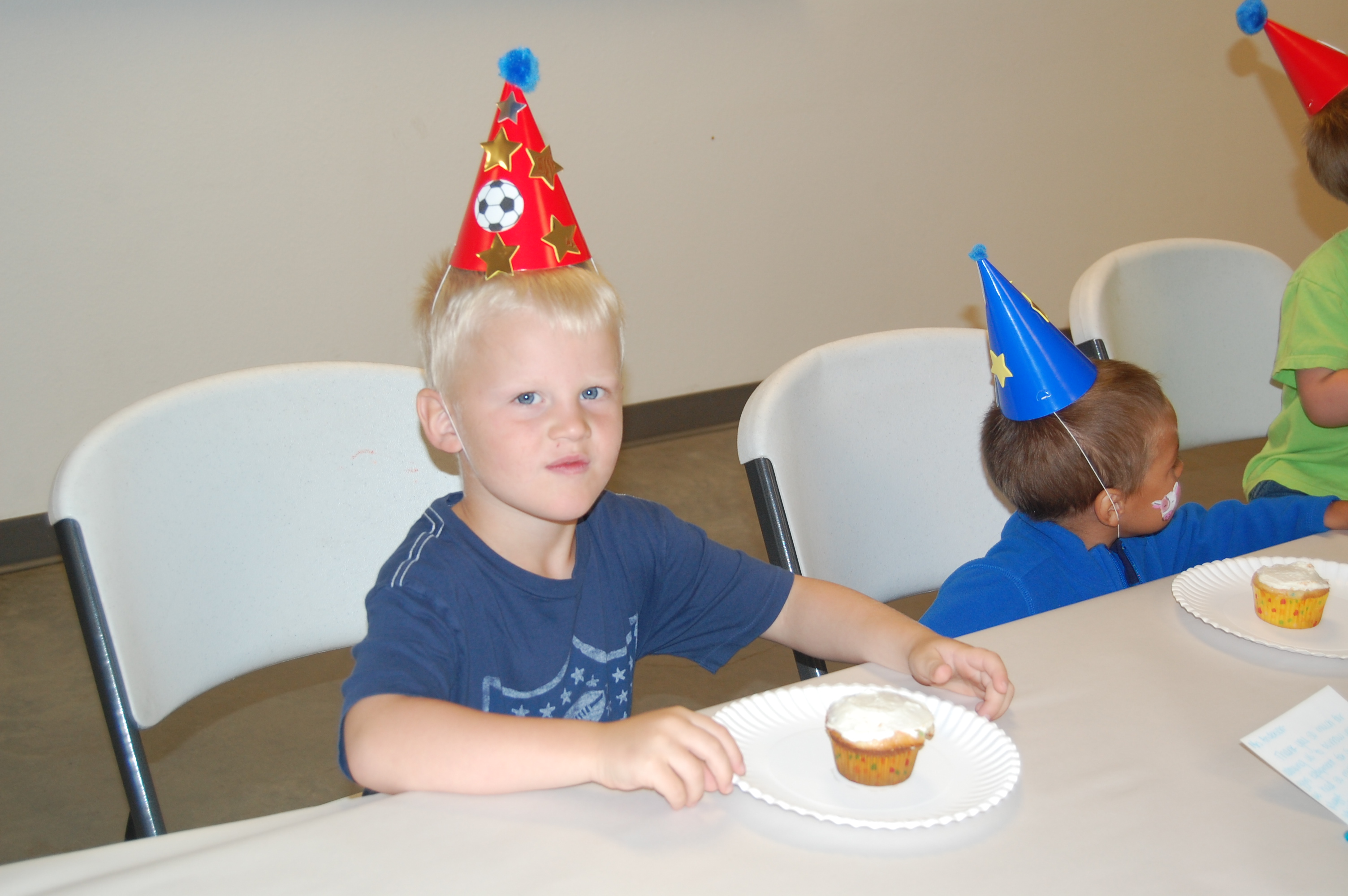 Conrad waiting to decorate his cupcake