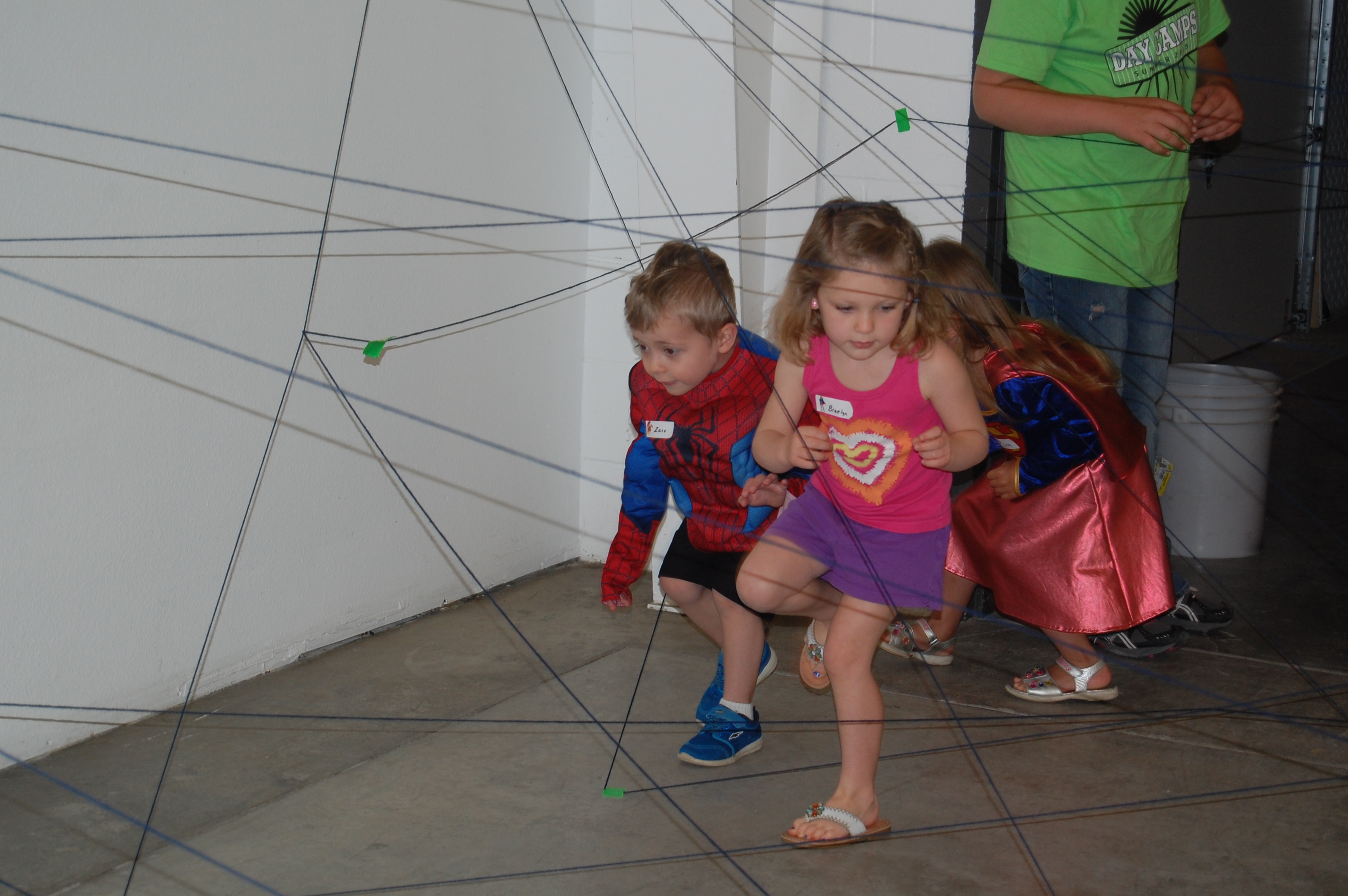 Zaco and Braelyn going through the spider web