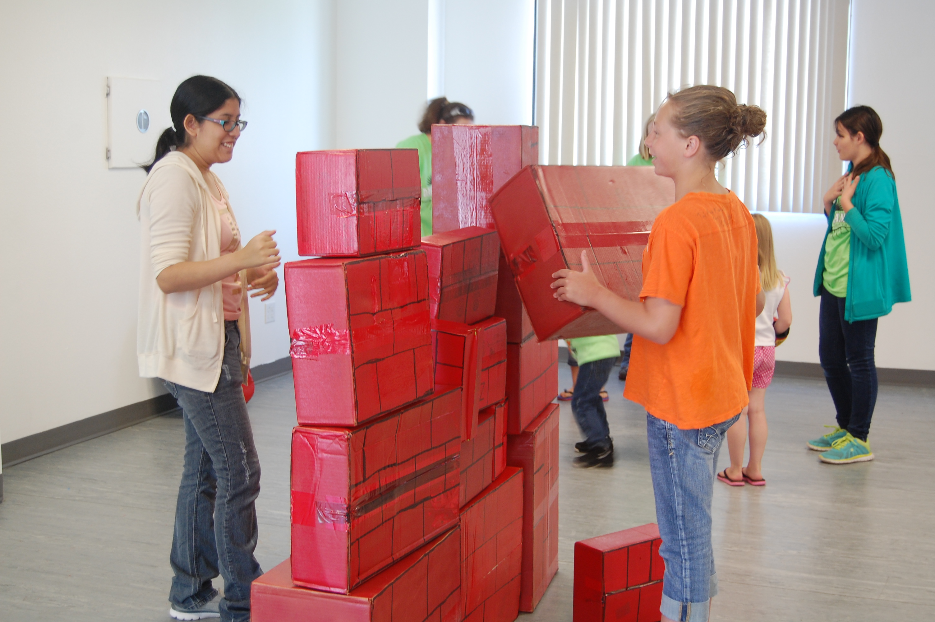helpers stacking the wall